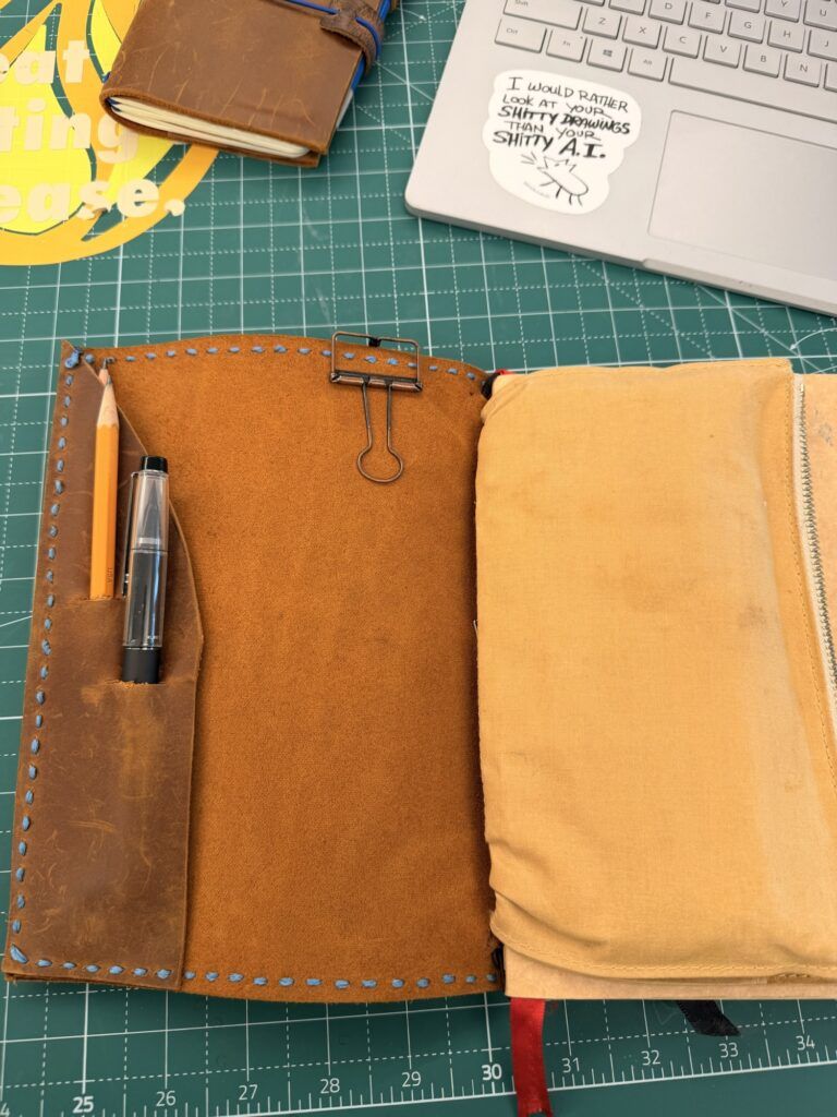 The front cover has a couple of slots for pencils and a brush pen. The slender folio pocket can also hold a plastic eraser and an extra pencil.