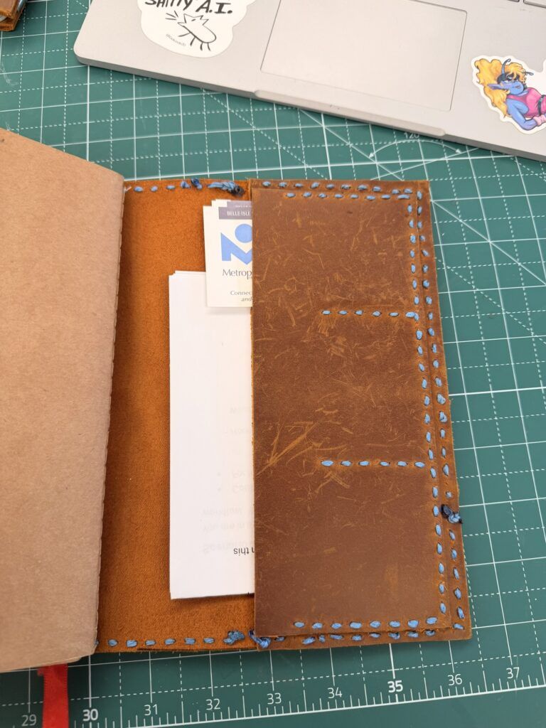 The back cover has a folder slot and 3 card slots